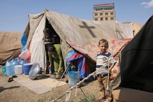 family_in_refugee_camp_in_yard_of_st-_elia_church_in_erbil_iraq-1