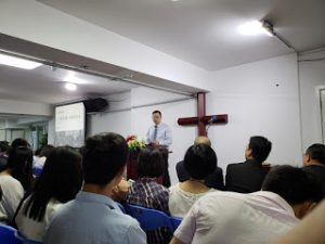 Pastor Wang preaching
