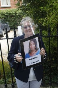 Ethel holding placard