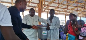 Aid bucket given to family (Zuru)