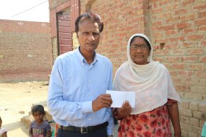 Woman receives cash aid