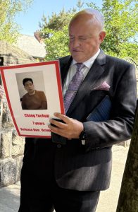 Aubrey McCarthy with placard