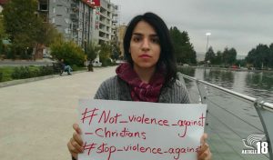 Mary Mohammadi with placard
